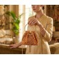 Orange evening bag with rhinestones and a gold handle