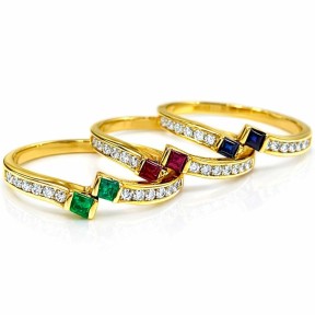 Combination of 3 rings with precious stones in  gold of 18 kts
