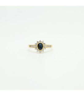 18 kts yellow gold ring with blue sapphire and zircons