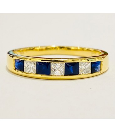 Sortija de zafiro azul y diamantes en oro amarillo de 18 kts