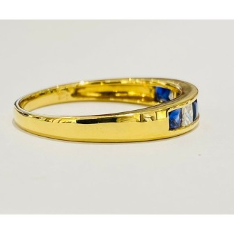 Sortija de zafiro azul y diamantes en oro amarillo de 18 kts