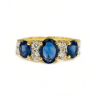 SORTIJA DE ORO BICOLOR DE 18 KTS CON ZAFIRO AZUL Y DIAMANTES