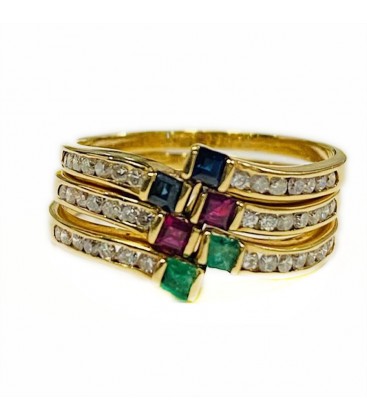 Combination of 3 rings with precious stones in gold of 18 kts