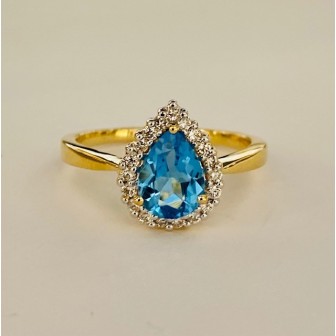 SORTIJA DE TOPACIO AZUL Y DIAMANTES MONTADO EN ORO AMARILLO 18CTS