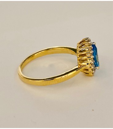 SORTIJA DE TOPACIO AZUL Y DIAMANTES MONTADO EN ORO AMARILLO 18CTS