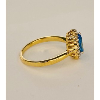 SORTIJA DE TOPACIO AZUL Y DIAMANTES MONTADO EN ORO AMARILLO 18CTS