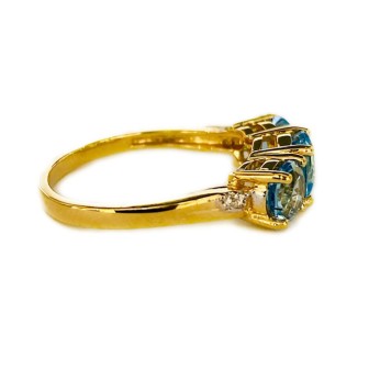 SORTIJA DE TOPACIO AZUL Y DIAMANTES MONTADO EN ORO AMARILLO 18CTS