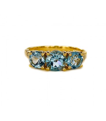 18 KTS GOLD RING WITH BLUE TOPAZ AND DIAMONDS