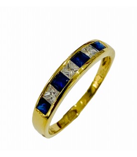 Sortija de zafiro azul y diamantes en oro amarillo de 18 kts