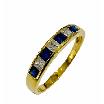 Sortija de zafiro azul y diamantes en oro amarillo de 18 kts