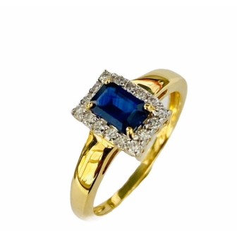 Sortija de oro amarillo de 18 kts con zafiro azul y diamantes
